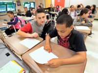 Roosevelt Middle School 8th graders, Justin Pacall Ferrer and Devon McCarthy check each others schedule on their first day of school, as students across New Bedford return to school.  [ PETER PEREIRA/THE STANDARD-TIMES/SCMG ]